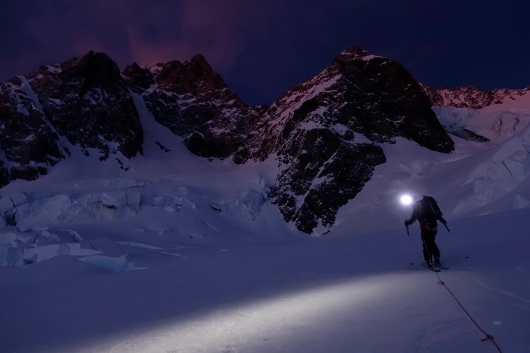 Ross Hewitt approaching the Bowie Couloir Aoraki / Mount Cook at night by Dave Searle